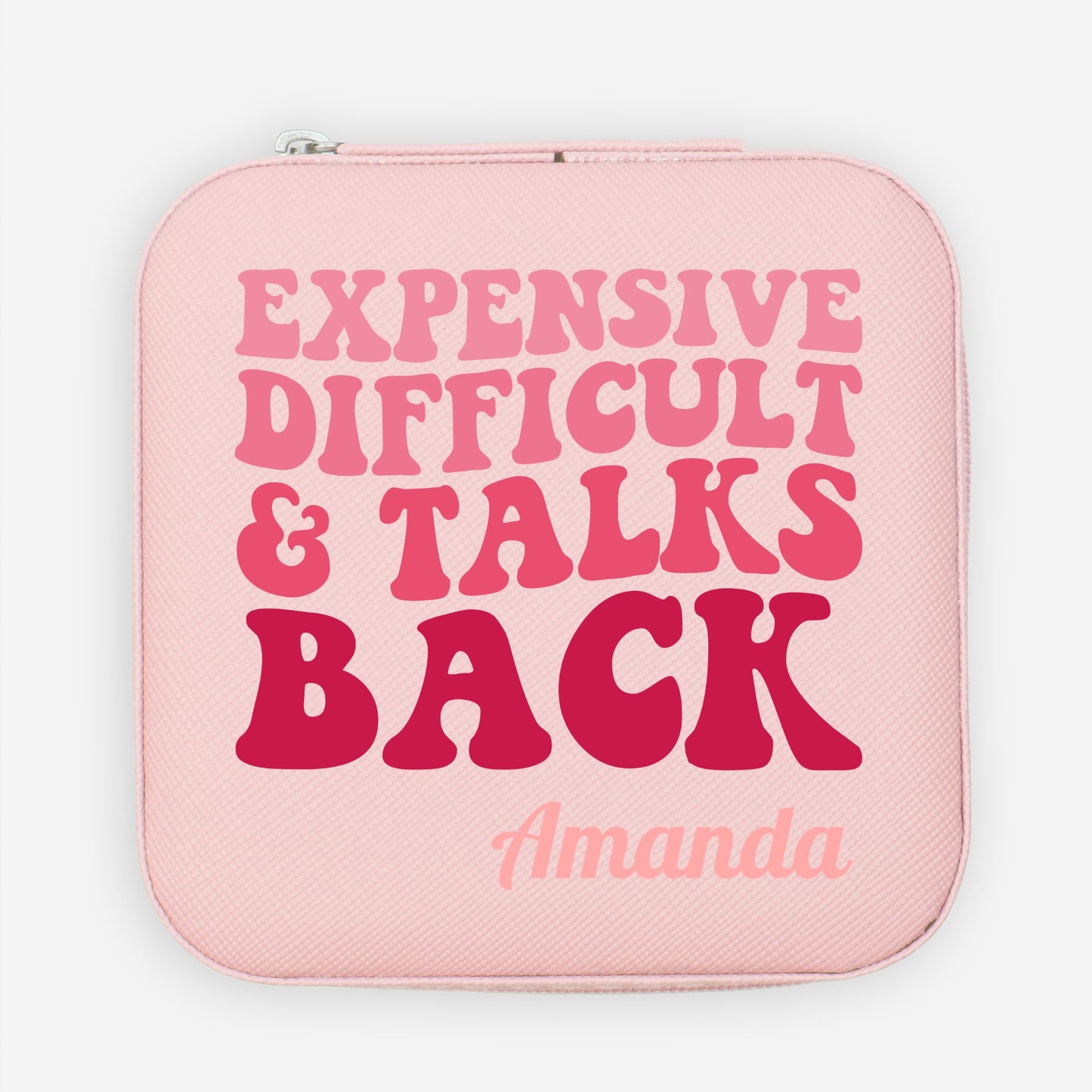 Expensive difficult & talks back in a retro wavy monochromatic font. A pink faux leather travel jewelry organizer with a custom name and funny quote.