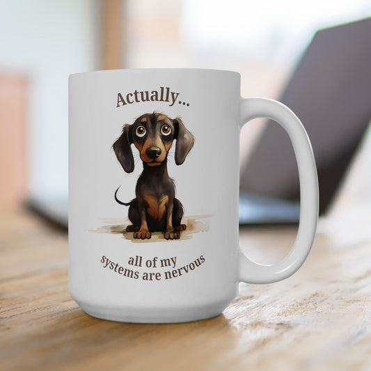 Cute dachshund coffee mug that says actually... all of my systems are nervous. A white ceramic 15 oz mug on a desk.