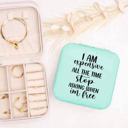 Teal travel jewelry case with a funny quote. Black text reads I am expensive all of the time stop asking when I'm free.